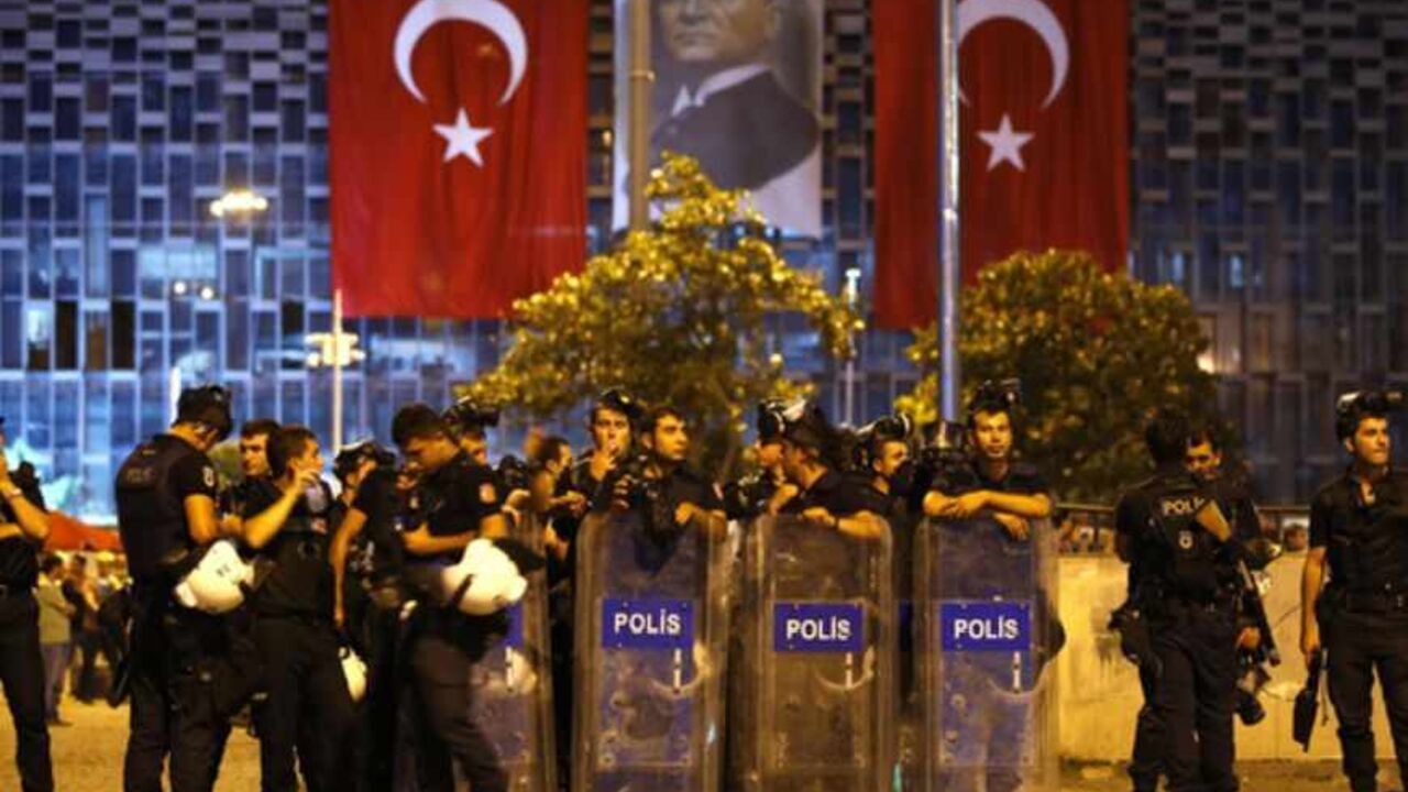 Riot police stand guard at Taksim Square in Istanbul June 22, 2013. Turkish riot police fired water cannon and teargas to disperse thousands of anti-government demonstrators in central Istanbul on Saturday, as Prime Minister Tayyip Erdogan castigated those behind protests he said had played into the hands of Turkey's enemies. REUTERS/Marko Djurica (TURKEY - Tags: CIVIL UNREST POLITICS) - RTX10XJP