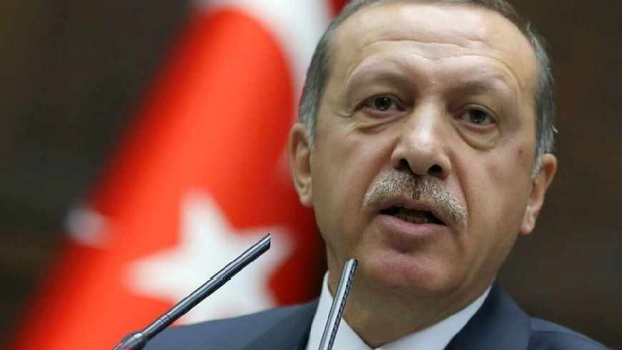 Turkey's Prime Minister Tayyip Erdogan addresses members of parliament from his ruling AK Party (AKP) during a meeting at the Turkish parliament in Ankara June 25, 2013. Turkish anti-terrorism police detained 20 people in raids in the capital Ankara on Tuesday in connection with weeks of anti-government protests across the country, media reports said. The unrest began at the end of May when police used force against campaigners opposed to plans to redevelop a central Istanbul park. The protest spiralled int