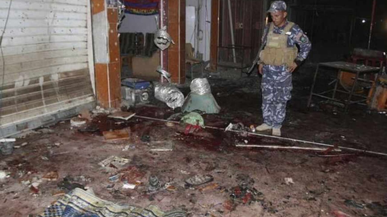 ATTENTION EDITORS - VISUAL COVERAGE OF SCENES OF INJURY OR DEATH

An police officer inspects the site of a bomb attack at a coffee shop in Kirkuk, 250 km (155 miles) north of Baghdad, July 12, 2013. A bomb attack in a cafe in northern Iraq killed at least 31 people on Friday, police and medics said. The blast took place in the ethnically mixed city of Kirkuk, in a coffee shop where people had gathered after breaking their fast for the Muslim holy month of Ramadan. REUTERS/Ako Rasheed (IRAQ - Tags: CIVIL U