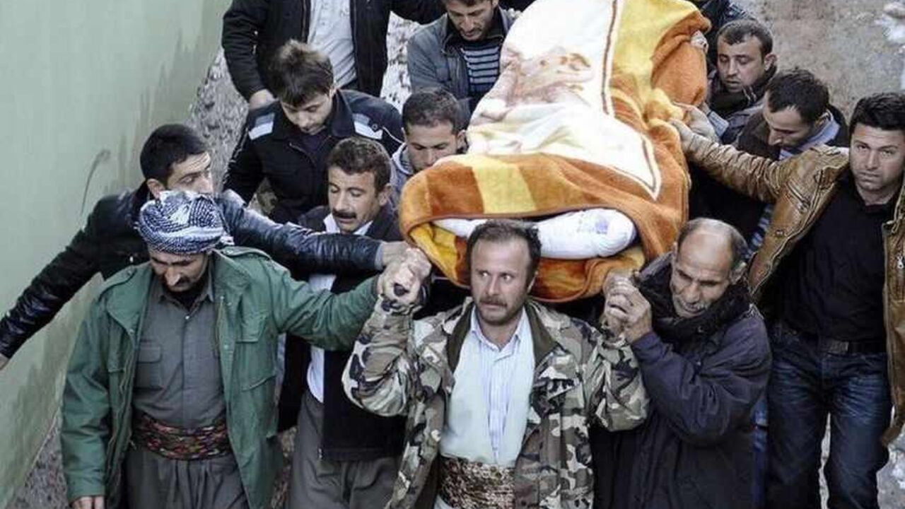 Locals carry a victim, killed in air strikes, to the morgue of a hospital in Uludere, of the Sirnak province December 29, 2011. Turkish warplanes launched air strikes against suspected Kurdish militants in northern Iraq near the Turkish border overnight, the military said on Thursday, but local officials said the attack killed 35 smugglers who were mistaken for guerrillas. The Turkish military confirmed it had launched the strikes after unmanned drones spotted suspected rebels of the Kurdistan Workers' Part