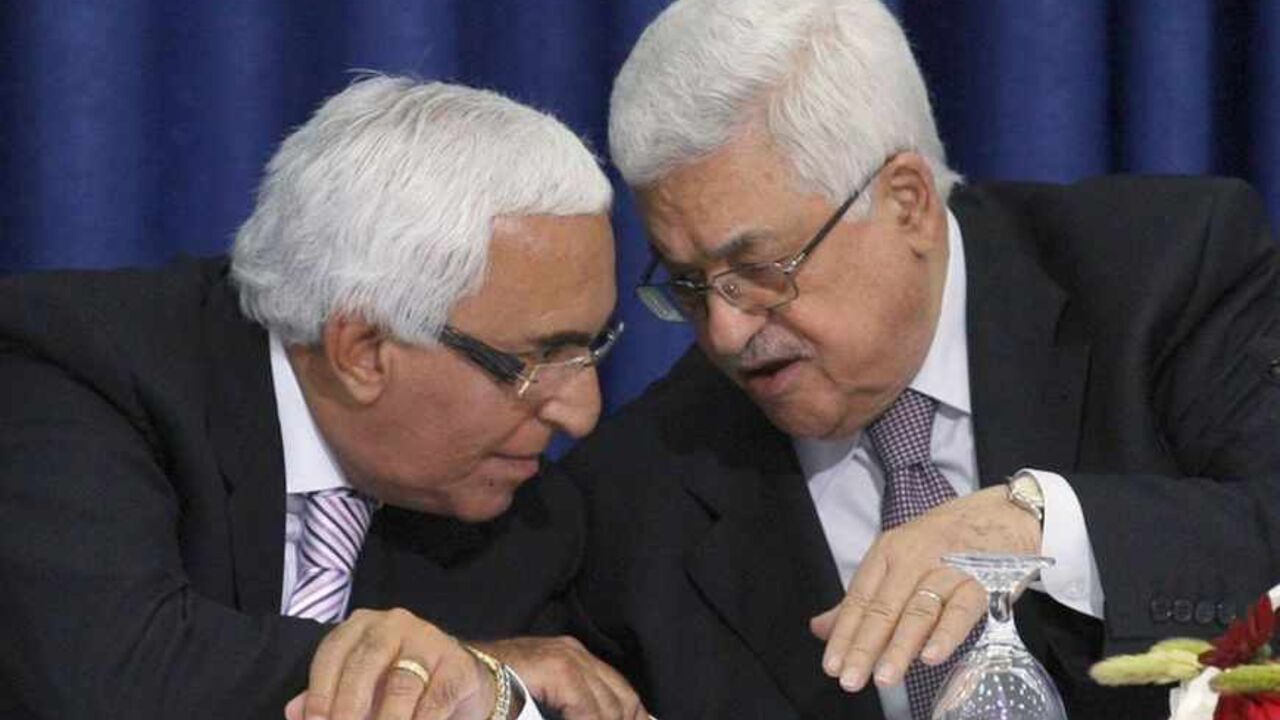Palestinian President Mahmoud Abbas (R) speaks to Moshe Shahal, a member of the Israel Peace Initiative and a former Israeli cabinet minister, during a news conference after Abbas met members of the Israeli Peace Initiative in the West Bank city of Ramallah April 28, 2011. The Israel Peace Initiative, a private group that includes former politicians and security officials, wants Israeli Prime Minister Benjamin Netanyahu's government to renew peace talks, which the Palestinians have frozen over his refusal t