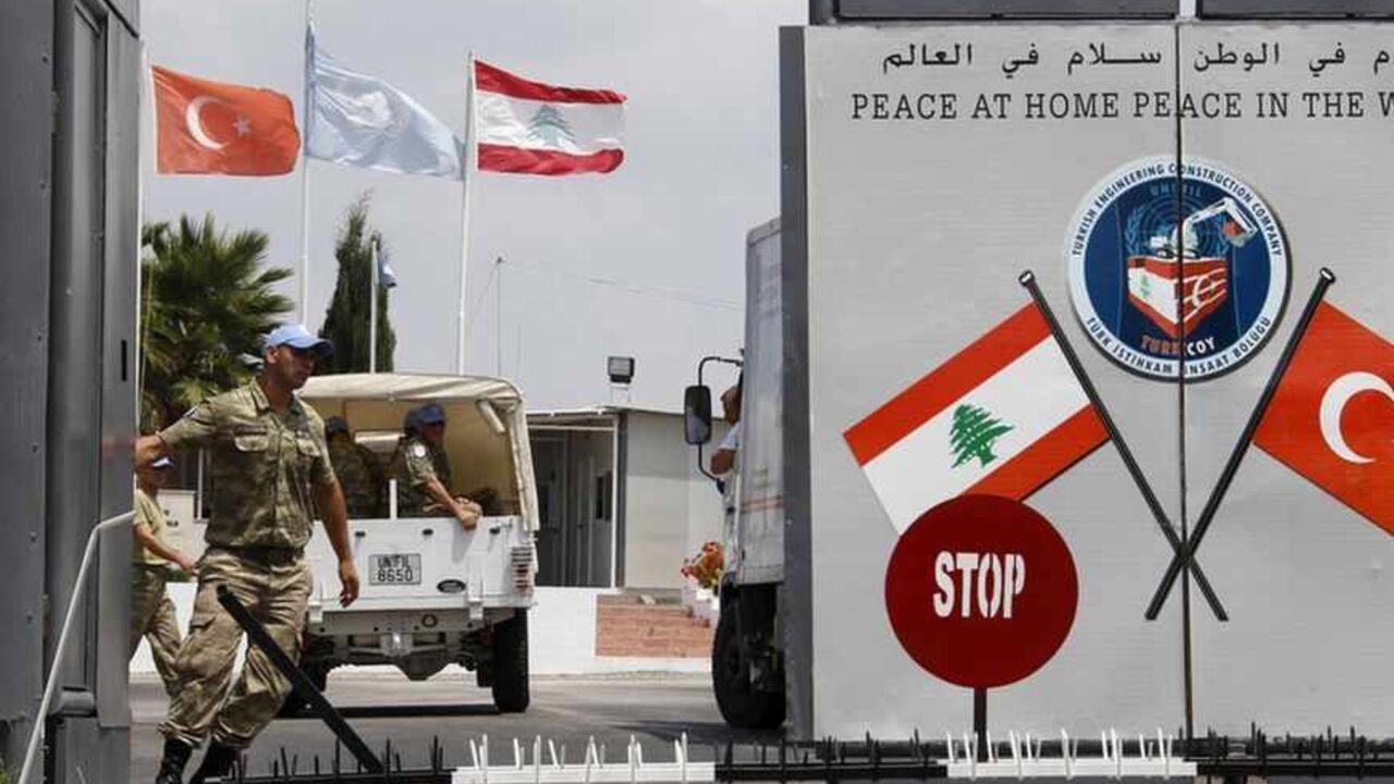 A Turkish peacekeeper of the United Nations Interim Force in Lebanon (UNIFIL) closes a gate of the Turkish Engineering Construction Company (TURKCOY) of UNIFIL in the village of Shaaytiyeh, southern Lebanon, August 12, 2013. Gunmen abducted two Turkish Airlines pilots in Beirut on Friday, forcing them from an airport bus in the early hours of the morning and prompting Turkey to urge its citizens to leave Lebanon. Turkey warned it citizens against non-essential travel to Lebanon and called on those already i