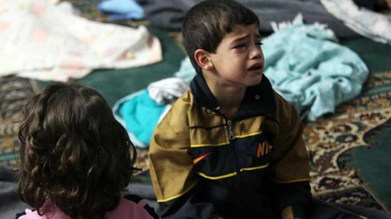 A boy who survived from what activists say is a gas attack cries as he takes shelter inside a mosque in the Duma neighbourhood of Damascus August 21, 2013. Syrian activists accused President Bashar al-Assad's forces of launching a gas attack that killed nearly 500 people on Wednesday, in what would, if confirmed, be by far the worst reported use of chemical arms in the two-year-old civil war. The Syrian armed forces strongly denied using chemical weapons. Syrian state television said the accusations were fa