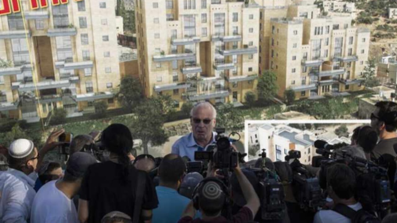 Israeli Housing Minister Uri Ariel speaks to reporters at a ceremony announcing the resumption of construction of an Israeli neighbourhood in East Jerusalem August 11, 2013. Israel moved forward on Sunday with plans to build nearly 1,200 new homes for Jewish settlers holding fast to a defiant settlement policy just days before its expected release of Palestinian prisoners.       REUTERS/Ronen Zvulun (JERUSALEM - Tags: POLITICS) - RTX12HFR