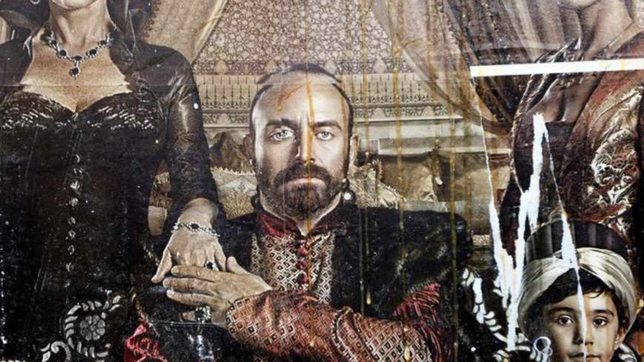 A billboard advertising the TV series "The Magnificent Century" is seen after being damaged by eggs thrown by pro-Islamic protesters in Istanbul January 9, 2011. A steamy television period drama about a 16th century sultan has angered conservative Muslims in Turkey and sparked a debate over the portrayal of the past in a country rediscovering its Ottoman heritage. "The Magnificent Century" chronicles the life of Suleiman the Magnificent, who ruled the Ottoman Empire during its golden age, showing a young an