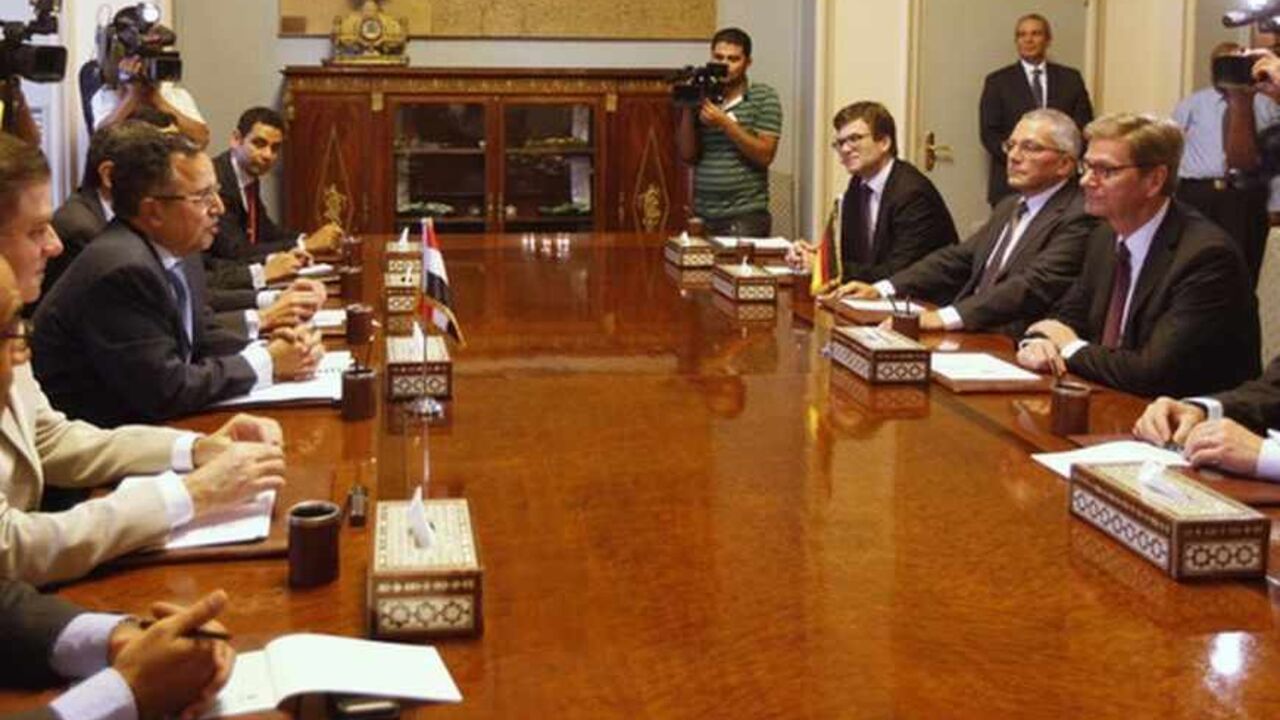 Egypt's interim Foreign Minister Nabil Fahmy (3rd L) speaks as German Foreign Minister Guido Westerwelle (2nd R) looks on during their meeting in Cairo August 1, 2013. Germany urged Egypt to avoid "the appearance of selective justice" on Thursday amid a crackdown on deposed President Mohamed Mursi's Muslim Brotherhood, which remained defiantly dug in at a protest camp the police have orders to remove. REUTERS/Mohamed Abd El Ghany (EGYPT  - Tags: POLITICS CIVIL UNREST) - RTX126WM