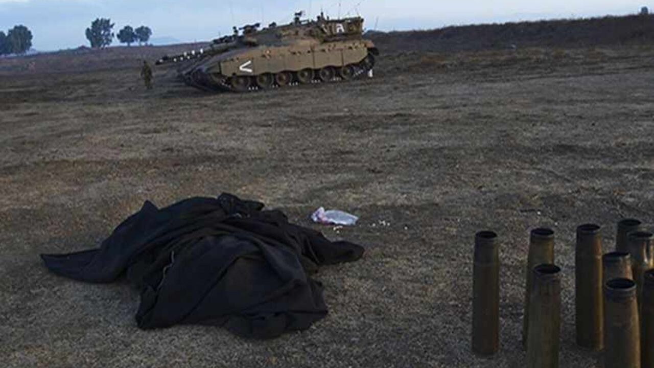 An Israeli soldier walks near tanks in the Israeli-occupied Golan Heights September 1, 2013. Israel's Prime Minister Benjamin Netanyahu played up Israel's ability to take on foes alone on Sunday after Washington backed off a threatened attack on Syria, prompting some Israelis to question their main ally's resolve against Iran. Israel remains technically at war with Syria, which has long demanded an Israeli withdrawal from the strategic Golan Heights, land that Israel captured in a 1967 war.  REUTERS/Ronen Z