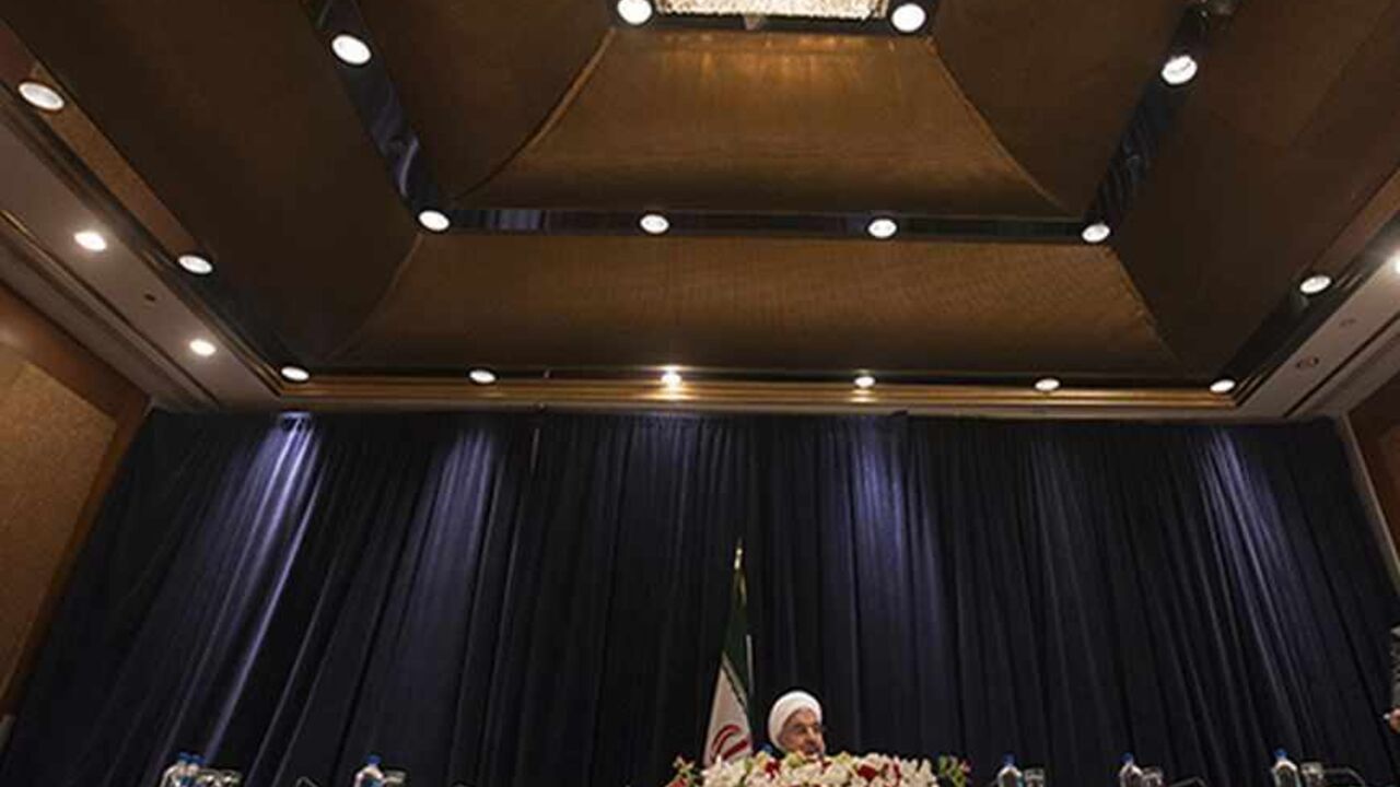 Iran's President Hassan Rouhani (L) speaks during a news conference in New York September 27, 2013.  New Iranian President Rouhani said on Friday he wanted talks with major powers on Iran's nuclear program to yield results in a short period of time and that the improved mood in U.S.-Iranian relations could lead to better ties. REUTERS/Adrees Latif (UNITED STATES - Tags: POLITICS ENERGY) - RTX142CF