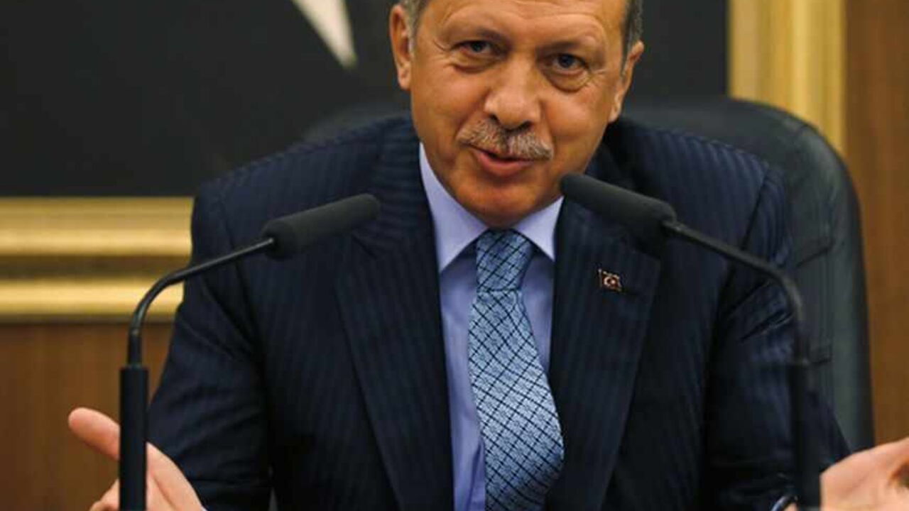 Turkey's Prime Minister Tayyip Erdogan gestures as he addresses the media before leaving for Turkmenistan at Esenboga Airport in Ankara August 15, 2013.  Erdogan called on Thursday for the U.N. Security Council to convene quickly and act after what he described as a massacre in Egypt, during a news conference in Ankara. REUTERS/Umit Bektas (TURKEY - Tags: POLITICS) - RTX12M4D