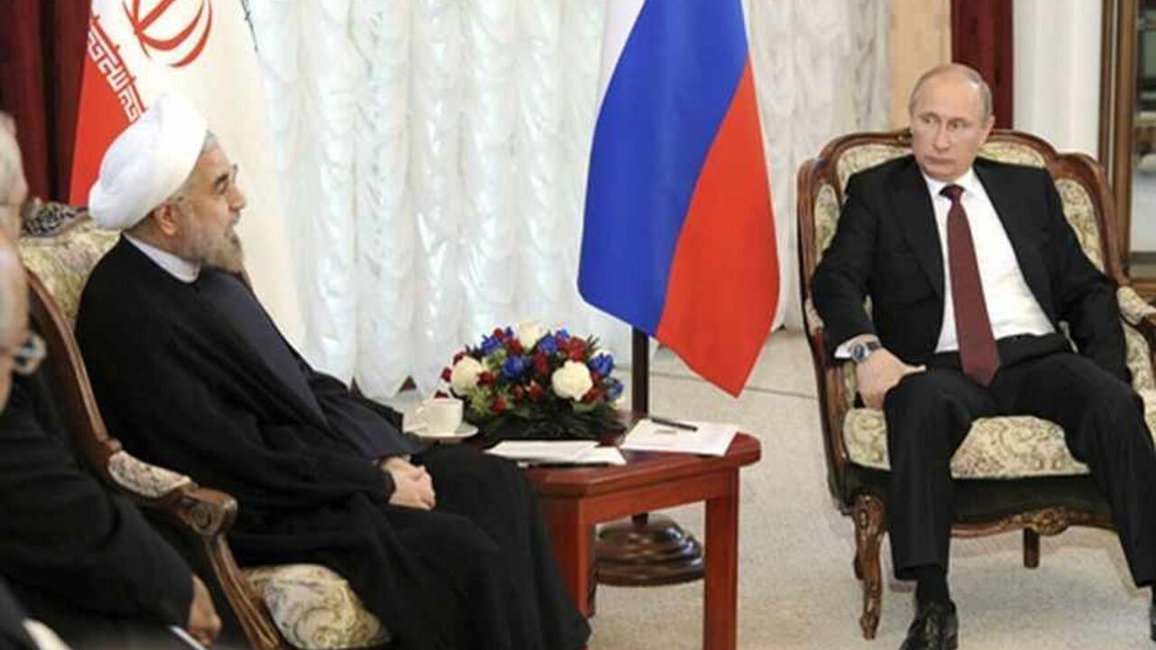 Russia's President Vladimir Putin (R) meets with his Iranian counterpart Hassan Rouhani during the Shanghai Cooperation Organization (SCO) summit in Bishkek, September 13, 2013. Rouhani said on Friday that he wanted a swift resolution to a dispute over Tehran's nuclear programme, which Western states fear is aimed at developing nuclear weapons.  REUTERS/Mikhail Klimentyev/RIA Novosti/Kremlin (KYRGYZSTAN - Tags: POLITICS) ATTENTION EDITORS - THIS IMAGE HAS BEEN SUPPLIED BY A THIRD PARTY. IT IS DISTRIBUTED, E