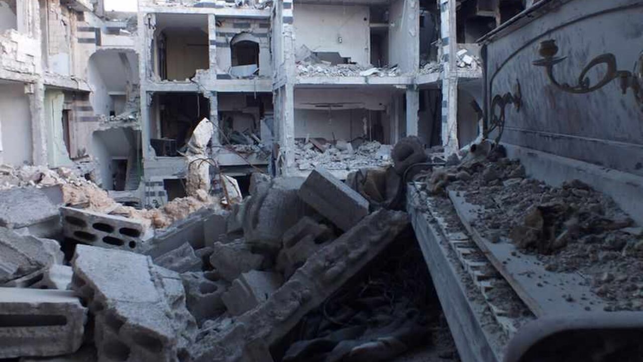 A general view shows a damaged piano amid buildings destroyed by what activists said was shelling by forces loyal to Syria's President Bashar al-Assad in the besieged area of Homs September 2, 2013. REUTERS/Yazan Homsy  (SYRIA - Tags: POLITICS CIVIL UNREST) - RTX1351E