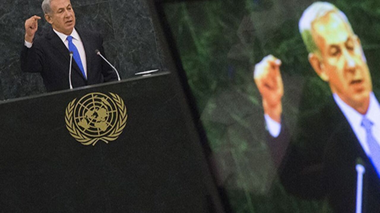 Israel's Prime Minister Benjamin Netanyahu is pictured on a television monitor while addressing the 68th session of the United Nations General Assembly in New York October 1, 2013. REUTERS/Adrees Latif (UNITED STATES - Tags: POLITICS) - RTR3FHES