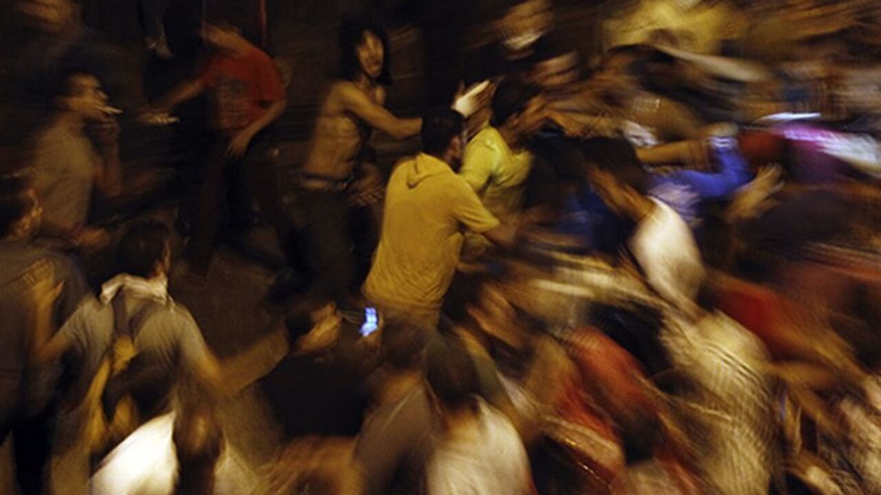 Anti-Mursi protesters clash with members of the Muslim Brotherhood and supporters of ousted Egyptian President Mohamed Mursi, at Ramsis square, which leads to Tahrir Square, during a celebration marking Egypt's 1973 war with Israel, in Cairo October 6, 2013. At least 33 people were killed during protests in Egypt on Sunday, the interior ministry said, as the crisis since the army seized power three months ago showed no sign of abating. REUTERS/Amr Abdallah Dalsh (EGYPT - Tags: POLITICS CIVIL UNREST) - RTR3F