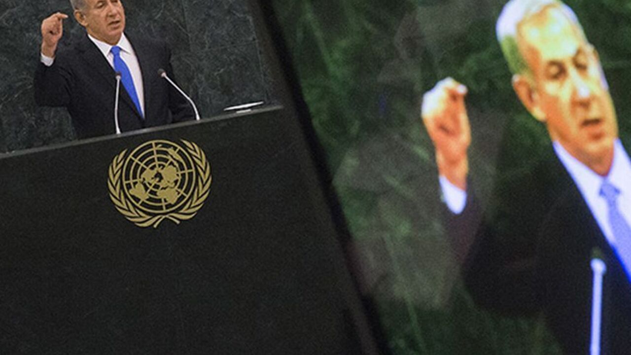 Israel's Prime Minister Benjamin Netanyahu is pictured on a television monitor while addressing the 68th session of the United Nations General Assembly in New York October 1, 2013. REUTERS/Adrees Latif (UNITED STATES - Tags: POLITICS) - RTR3FHES