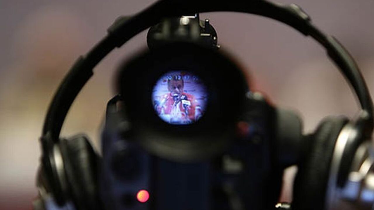 Head coach of the Swiss national soccer team Ottmar Hitzfeld is shown on a video camera during a news conference in Tel Aviv September 5, 2008. The Swiss national soccer team will play Israel in their first World Cup 2010 qualification match on Saturday. REUTERS/Stefan Wermuth (ISRAEL) - RTX8FMX