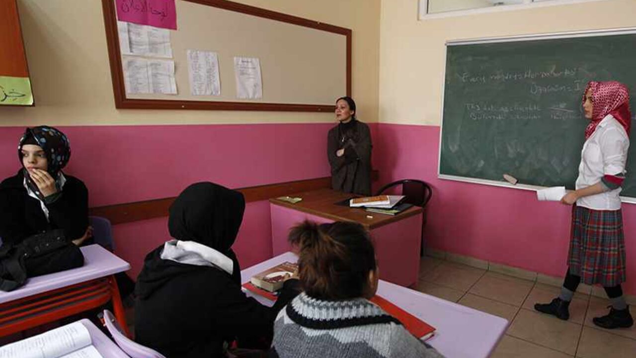 Turkish girls attend English class at the Kazim Karabekir Girls' Imam-Hatip School in Istanbul February 10, 2010. The imam-hatip network is a far cry from the western stereotype of the madrassa as an institution that teaches the Koran by rote and little else. Originally founded to educate Muslim religious functionaries in the 1920s, the imam-hatip syllabus devotes only around 40 percent of study to religious subjects like Arabic, Islamic jurisprudence and rhetoric. The rest is given over to secular topics. 