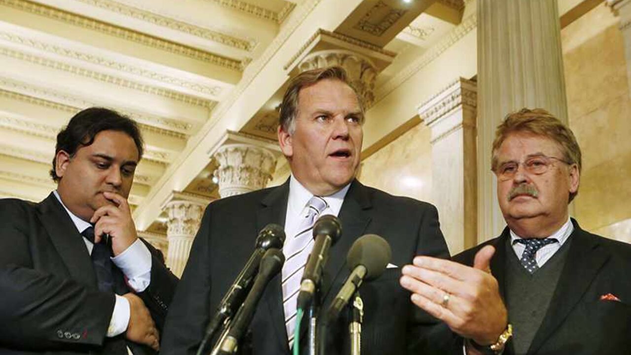 Chairman of the House Permanent Select Committee on Intelligence U.S. Rep. Mike Rogers (R-MI) (C) speaks next to European Parliament leader of the Civil Liberties Committee Inquiry Claude Moraes (L) and German Member of the European Parliament and the current Chairman of the European Parliament Committee on Foreign Affairs Elmar Brok (R) about a closed door meeting on NSA surveillance on U.S. allies while on Capitol Hill in Washington, October 28, 2013. REUTERS/Larry Downing (UNITED STATES - Tags: POLITICS)
