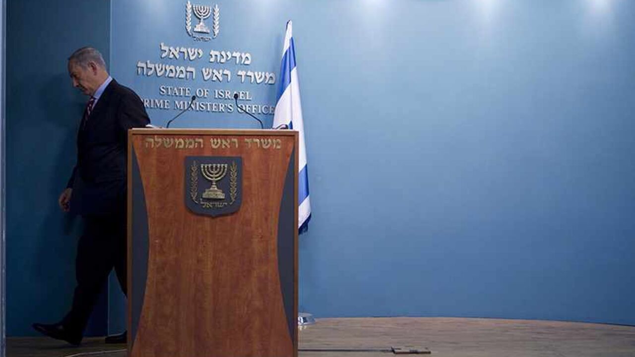 Israel's Prime Minister Benjamin Netanyahu leaves after delivering a statement at his office in Jerusalem November 24, 2013. Netanyahu on Sunday denounced the world powers' nuclear agreement with Iran as a historic mistake that left the production of atomic weapons within Tehran's reach. REUTERS/Baz Ratner (JERUSALEM - Tags: POLITICS) - RTX15R0J