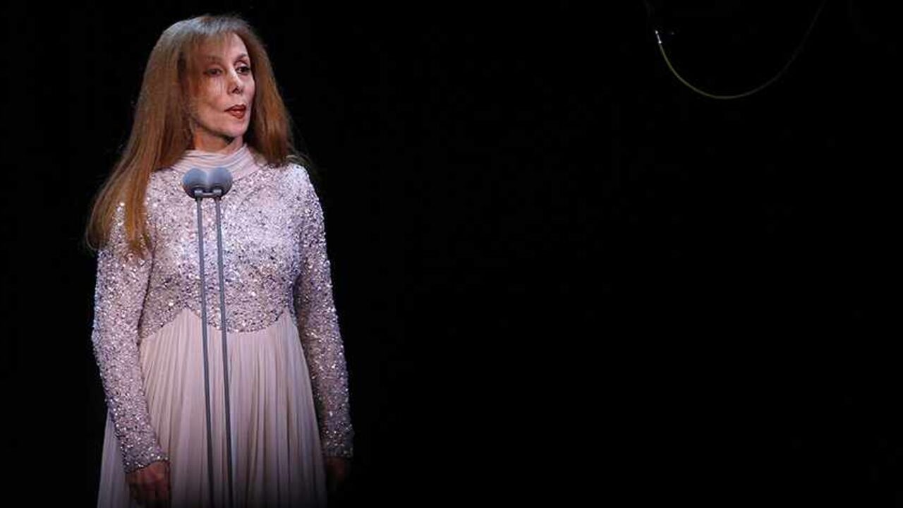 Lebanese diva Fairuz performs at Lebanon's new state-of-art Platea theatre in Sahel Alma north of the capital Beirut on December 9, 2011. The 77-year-old singer began her career in the early 1950s and became an icon across the Arab  world with hundreds of songs mainly written by the Rahbani Brothers and later her son Ziad Rahbani. AFP PHOTO/ANWAR AMRO (Photo credit should read ANWAR AMRO/AFP/Getty Images)