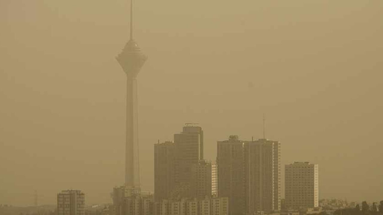 EDITORS' NOTE: Reuters and other foreign media are subject to Iranian restrictions on their ability to film or take pictures in Tehran.
A general view shows Tehran's Milad telecommunication tower (L) as the city is covered in dust July 6, 2009. The government closed private educational centres, state offices, industrial units and military bases for two days and raised its pollution alert status due to the dust, which an official from Tehran's environment office attributed the source to dust from dried marsh