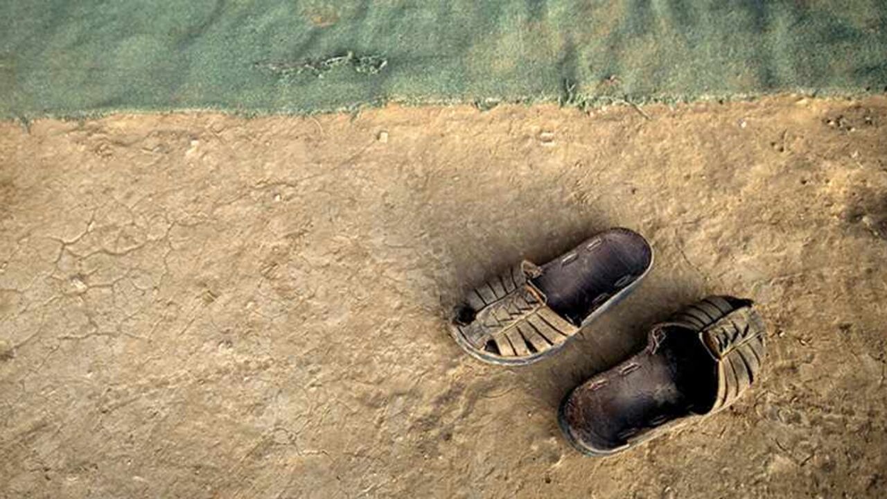 The sandals of a Palestinian bedouin lie in a tent south of the West Bank Jewish settlement of Mishor Adumim in the Judean Desert August 19, 2009. Many bedouins living in Israel and the occupied West Bank retain a traditional and nomadic way of life, raising livestock and farming arid land.  REUTERS/Ammar Awad (WEST BANK POLITICS SOCIETY) - RTR26VZK