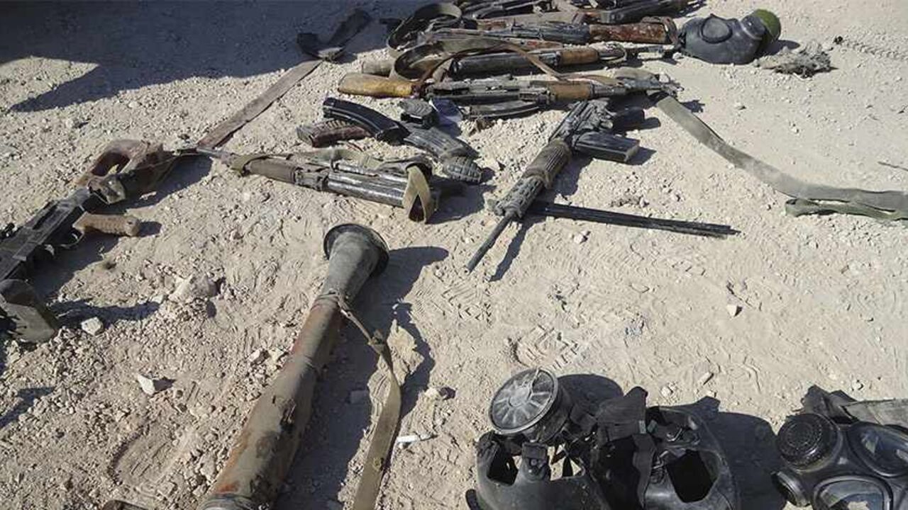 Weapons are seen in the sand near Adra, east of Damascus, in this handout photograph distributed by Syria's national news agency SANA August 7, 2013. Sixty-two rebel fighters were killed in a Syrian army ambush at dawn on Wednesday near the town of Adra, east of Damascus, said the Syrian Observatory for Human Rights, a monitoring group opposed to President Bashar al-Assad. The state news agency SANA did not give a death toll for the ambush but said the rebels were from the al Qaeda-linked al-Nusra Front. It