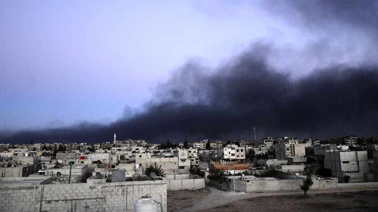 Smoke rises into the sky from what activists said was Free Syrian Army fighters destroying a tank that belonged to forces loyal to Syria's President Bashar al-Assad in the Qaboun area, eastern Ghouta, September 15, 2013. REUTERS/Bassam Khabieh (SYRIA - Tags: POLITICS CIVIL UNREST CONFLICT) - RTX13MHE
