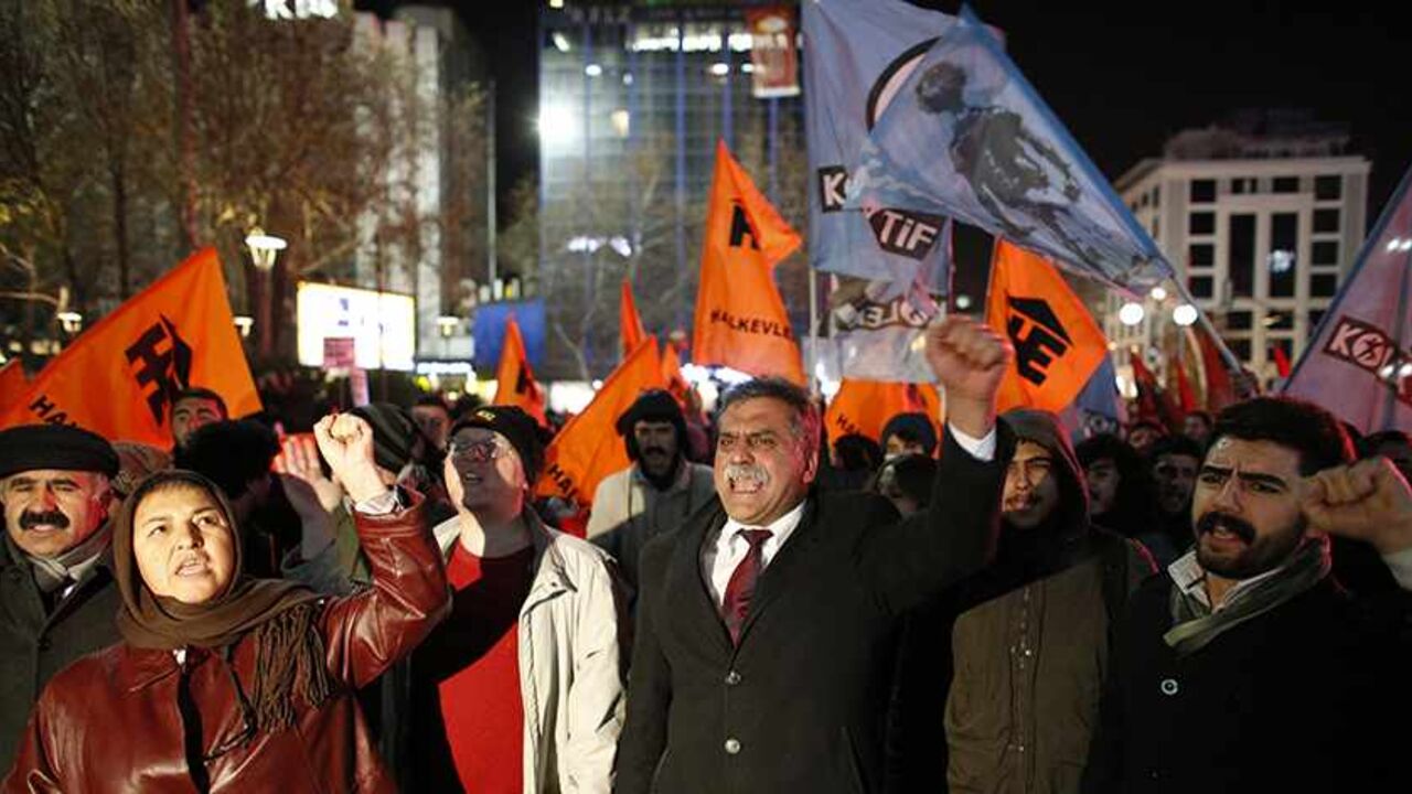 Protesters demonstrate against Turkey's ruling Ak Party (AKP) government and demand that Prime Minister Tayyip Erdogan's resign because of the corruption investigation in Ankara December 18, 2013. Turkish Deputy Prime Minister Bulent Arinc said on Wednesday a corruption investigation in which 52 people including the sons of three cabinet ministers have been detained was part of a "planned operation" to tarnish the government. In the first official comments on the investigation from a senior member of the go