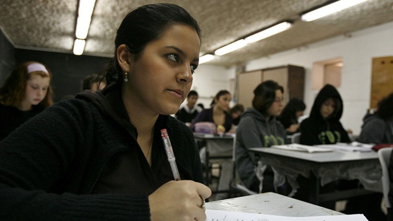 An Israeli high school student looks up during class in a bomb shelter in the southern city of Beersheba January 12, 2009. Israeli troops fought fierce gun battles with Hamas fighters on Monday, keeping military pressure on the Islamist group while avoiding urban warfare that would complicate ongoing diplomatic efforts to end the Gaza war. An Israeli military spokesman said army reservists had been thrown into the offensive that Israel launched 17 days ago with the declared aim of ending Hamas cross-border 