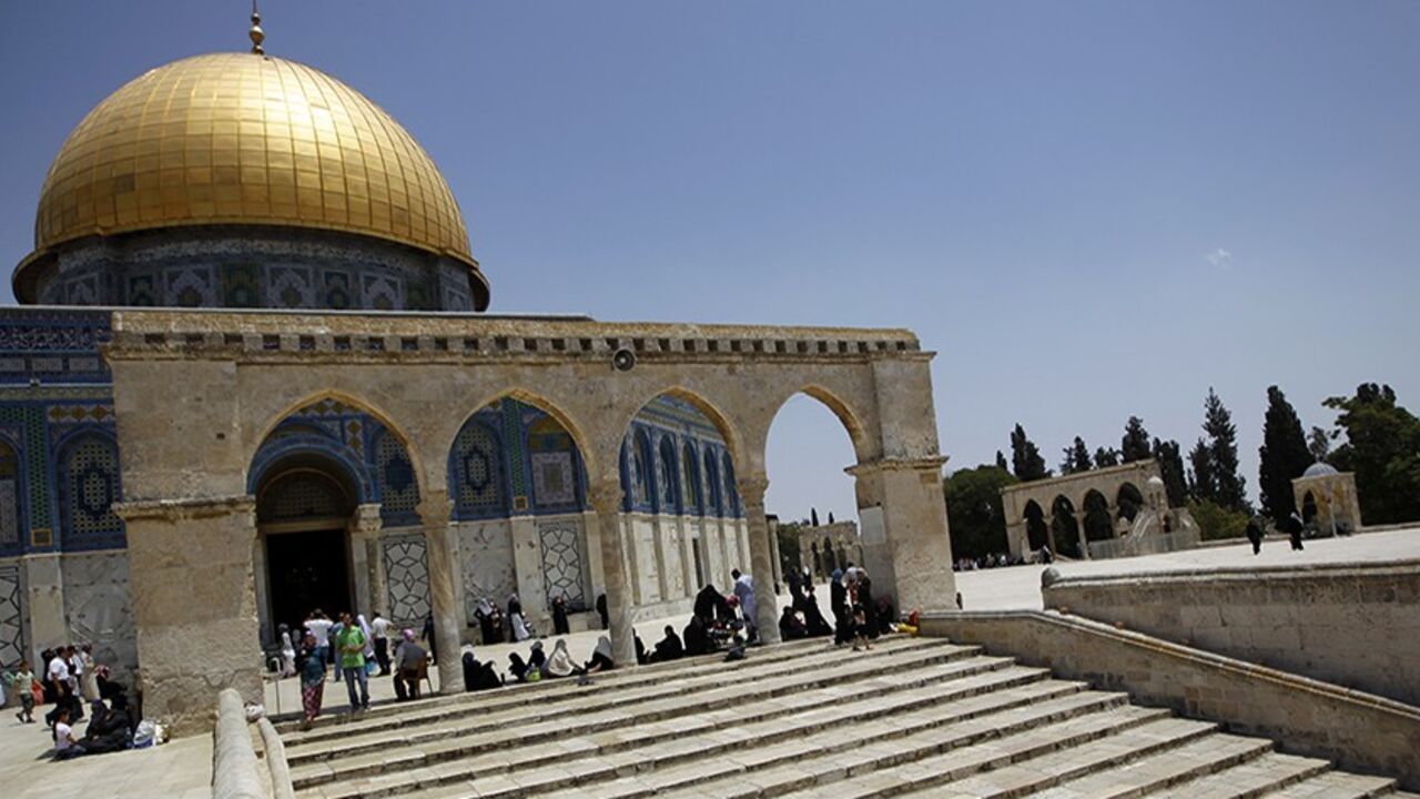People visit the compound known to Muslims as Noble Sanctuary and to Jews as Temple Mount in Jerusalem's Old City, where the Dome of the Rock (L) and Al-Aqsa mosque (not seen) stand May 18, 2012. The grand mosques in Mecca and Medina, the two holiest in Islam, draw millions of pilgrims annually. Al-Aqsa, the last of the three sacred sites the Prophet Mohammad urged Muslims to visit, sees only a few thousand foreign worshippers a year. Picture taken May 18, 2012. REUTERS/Ammar Awad (JERUSALEM - Tags: POLITIC
