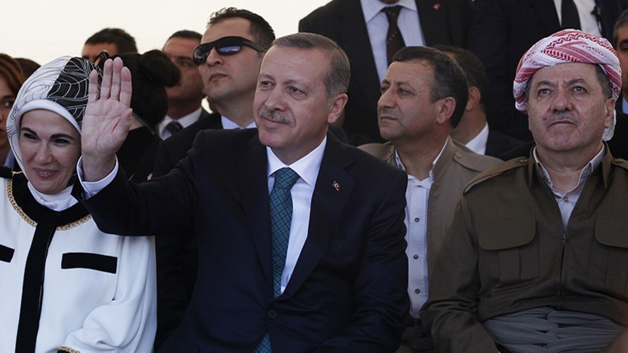 Turkey's Prime Minister Tayyip Erdogan and President of Iraqi Kurdistan Masoud Barzani (R) attend a ceremony with Erdogan's wife Emine Erdogan in Diyarbakir November 16, 2013. The president of Iraqi Kurdistan called on Turkey's Kurds to back a flagging peace process with Ankara on Saturday, making his first visit to southeastern Turkey in two decades in a show of support for Prime Minister Tayyip Erdogan. Barzani's trip to Diyarbakir, the main city in Turkey's Kurdish-dominated southeast, comes as Ankara fi