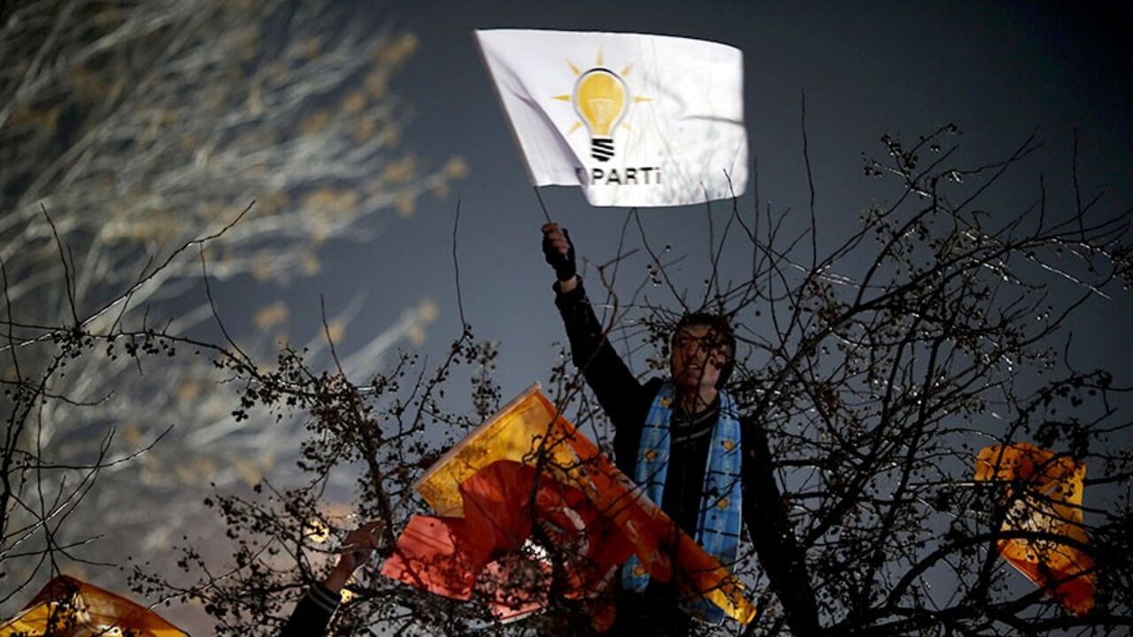 Supporters of Turkey's Prime Minister Tayyip Erdogan shout slogans and wave flags as they gather to welcome his arrival at Esenboga Airport in Ankara December 24, 2013. Turkey's President Abdullah Gul pledged on Tuesday there would be no cover-up in a high-level corruption case, despite a government-ordered purge of police investigating it that drew protests at home and a caution from the European Union. The week-long scandal, which erupted with the arrest for graft of 24 people, including the chief of a st