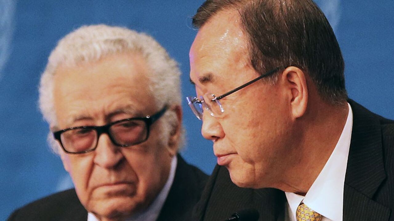 U.N. special envoy for Syria Lakhdar Brahimi speaks to U.N. Secretary-General Ban Ki-moon (R) during a news conference after the Geneva-2 peace talks in Montreux January 22, 2014. An international conference on Syria ended on Wednesday, with Ban calling on both Syrian delegations to work sincerely for a solution to the nearly three-year-old conflict. REUTERS/Jamal Saidi (SWITZERLAND - Tags: POLITICS) - RTX17Q4I