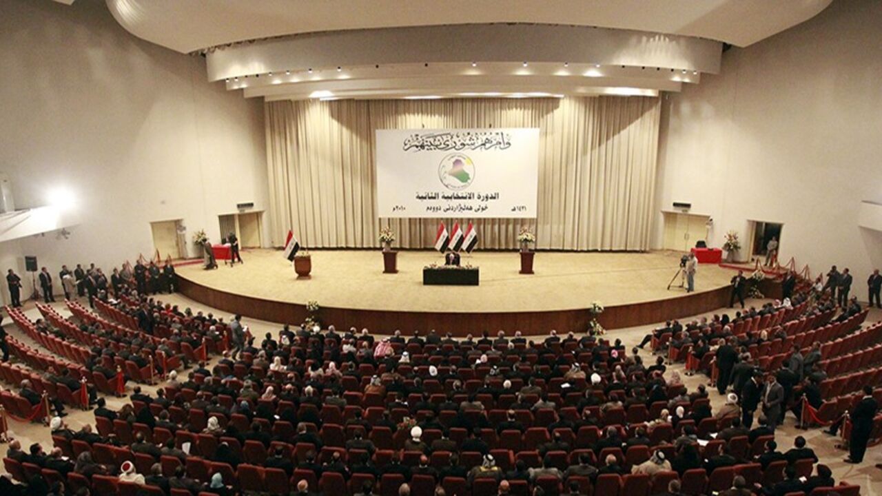 Members of the new Iraqi Parliament attend a session at the Parliament headquarters in Baghdad, November 11, 2010. Iraq's fractious politicians have agreed to return Shi'ite Nuri al-Maliki as prime minister, ending an eight-month deadlock that raised fears of renewed sectarian war, but leaving some Sunnis sceptical he can forge national unity. The pact on top government posts brings together Shi'ites, Sunnis and Kurds in a power-sharing arrangement similar to the last Iraqi government and could help prevent