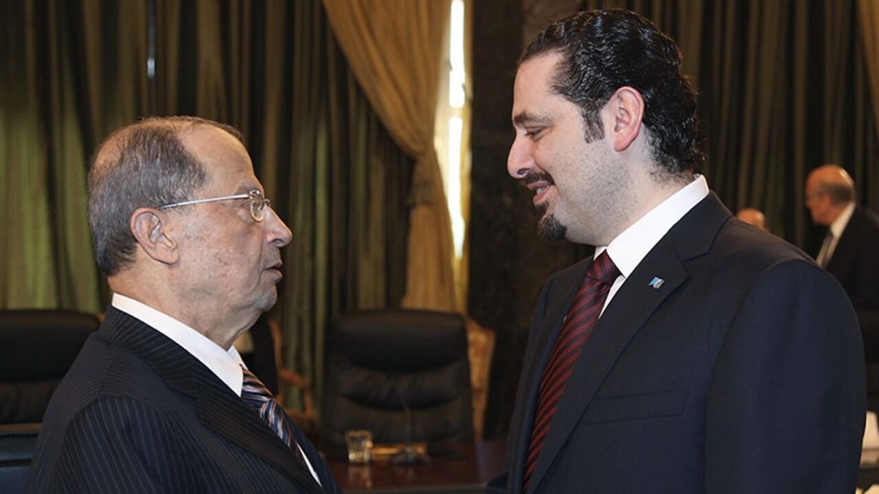 Lebanon's Prime Minister Saad al-Hariri (R) shakes hands with Lebanese Christian leader and head of the Free Patriotic Movement Michel Aoun during the eighth session of the national dialogue between political leaders at the Presidential Palace in Baabda, near Beirut March 9, 2010. REUTERS/Dalati Nohra/Handout (LEBANON - Tags: POLITICS RELIGION) FOR EDITORIAL USE ONLY. NOT FOR SALE FOR MARKETING OR ADVERTISING CAMPAIGNS - RTR2BEYN