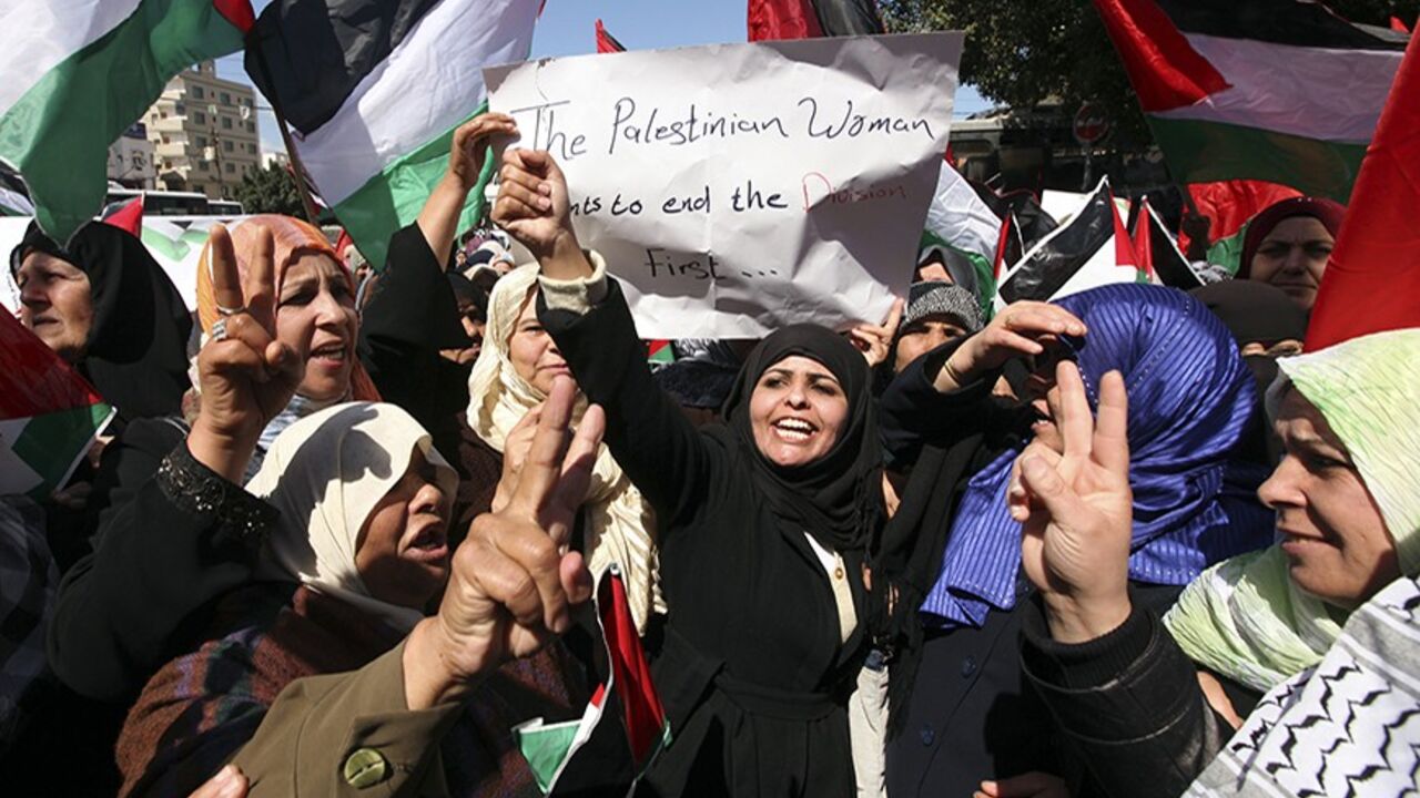 Palestinian women mark International Women's Day with a rally calling for an end to Palestinian divisions, in Gaza City March 8, 2011. Female protesters rallied to voice their frustrations over the unending split between Hamas and Abbas's Fatah movement and the lack of progress towards a peace that will end Israeli occupation and finally give them a state of their own. REUTERS/Mohammed Salem (GAZA - Tags: POLITICS SOCIETY IMAGES OF THE DAY) - RTR2JLMD