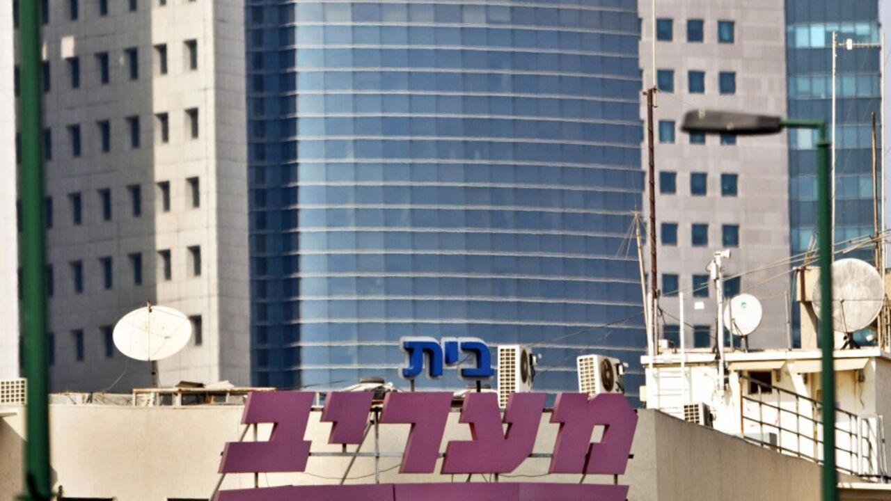 The logo of Maariv, one of Israel's largest tabloid newspapers, is seen on the newspaper's building in Tel Aviv September 9, 2012. Debt-strapped conglomerate IDB Group plans to sell Maariv for 85 million shekels ($21 million), Maariv said. REUTERS/Nir Elias (ISRAEL - Tags: BUSINESS MEDIA) - RTR37Q7Z