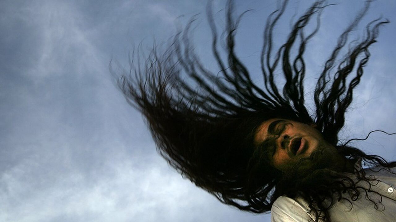 An Iraqi Dervish prays during a gathering outside their Tekiyah, a place of worship, in Baghdad, May 29, 2003. Swaying gently at first, chanting in monotones, the Dervishes slowly build up to a frenzy of prayers. Dervishes are Sufis, a spiritual offshoot of Islam, who believe their bodies open up to the energy of God when they are in prayer. Pictures of the month May 2003 NO RIGHTS CLEARANCES OR PERMISSIONS ARE REQUIRED FOR THIS IMAGE REUTERS/Damir Sagolj PP05080023  JD/CRB - RTROHMO