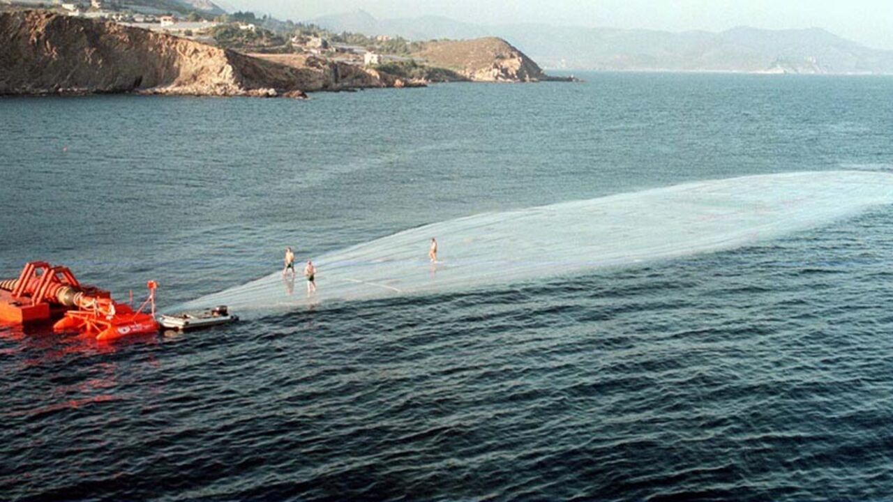 Technicians stand on a water balloon as it is floated off Aydincik  in the Mediterranean sea after it was filled with drinking water from Turkey  July 15. The balloon is expected to reach to northern Cyprus coastline on July 16.  The water ballon is dragged by a tug to test a planned method of supplying the drought-hit Northern Cyprus with drinking water. The giant ballons are 117.5 metre long, 23.3 metres wide and 5.6 metres high with a capacity of ten thousand cubic meters. - RTXI5YX