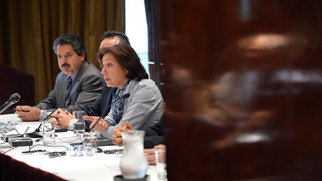 Syrian National Council members Bassma Kodmani (R) speaks as Najib Ghadbian (L) listens July 17, 2012 at a press conference in New York. Journalists are reflected in a door (R). AFP PHOTO/Stan HONDA        (Photo credit should read STAN HONDA/AFP/GettyImages)