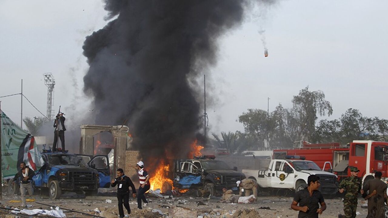 ATTENTION EDITORS - VISUAL COVERAGE OF SCENES OF INJURY OR DEATH

Iraqi security forces react at the scene of a car bomb attack at a Shi'ite political organisation's rally in Baghdad, April 25, 2014. A series of explosions killed 18 people at a Shi'ite political organisation's rally in Iraq on Friday, police and medical sources said. The militant group, Asaib Ahl Haq (League of the Righteous), introduced its candidates for elections on April 30 at the rally in eastern Baghdad. Three bombs exploded in succes