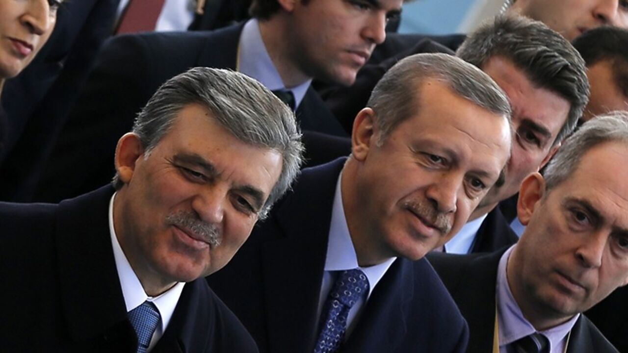 Turkish President Abdullah Gul (L) and Prime Minister Tayyip Erdogan arrive at an opening ceremony of a new line of the Ankara Metro in Ankara February 12, 2014. REUTERS/Umit Bektas (TURKEY - Tags: POLITICS) - RTX18NXZ