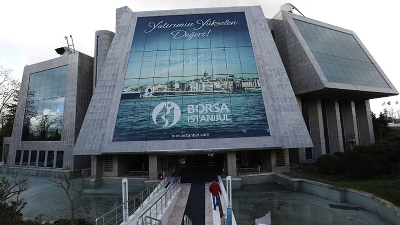 A man enters the Bourse Istanbul in Istanbul December 17, 2013. Turkey's Bourse Istanbul could acquire a minority stake in Nasdaq OMX Group as part of a tie-up that will involve the Turkish exchange using Nasdaq's market technologies, its chairman Ibrahim Turhan said on December 31, 2013. Bourse Istanbul will buy stock trading and clearing software and infrastructure from Nasdaq OMX and will be able to use and resell the software in 25 countries, in a move designed to attract more trade from the world's lea