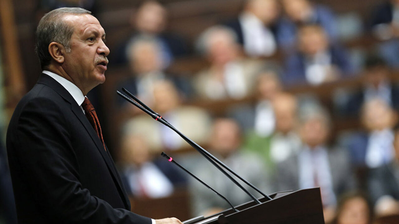 Turkey's Prime Minister Tayyip Erdogan addresses members of parliament from his ruling AK Party (AKP) during a meeting at the Turkish parliament in Ankara July 15, 2014. REUTERS/Umit Bektas (TURKEY - Tags: POLITICS) - RTR3YQ61