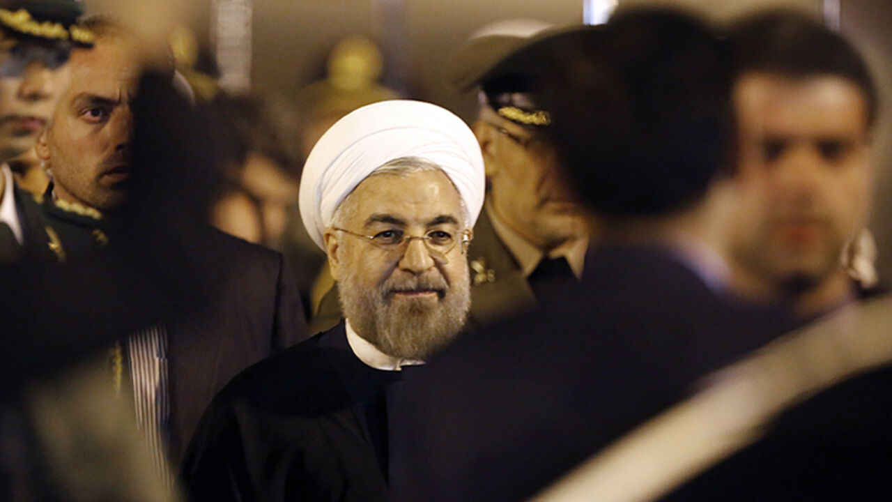 Iran's President Hassan Rouhani arrives at Pudong International Airport, ahead of the fourth Conference on Interaction and Confidence Building Measures in Asia (CICA) summit in Shanghai May 20, 2014.  REUTERS/Carlos Barria (CHINA - Tags: POLITICS) - RTR3Q000