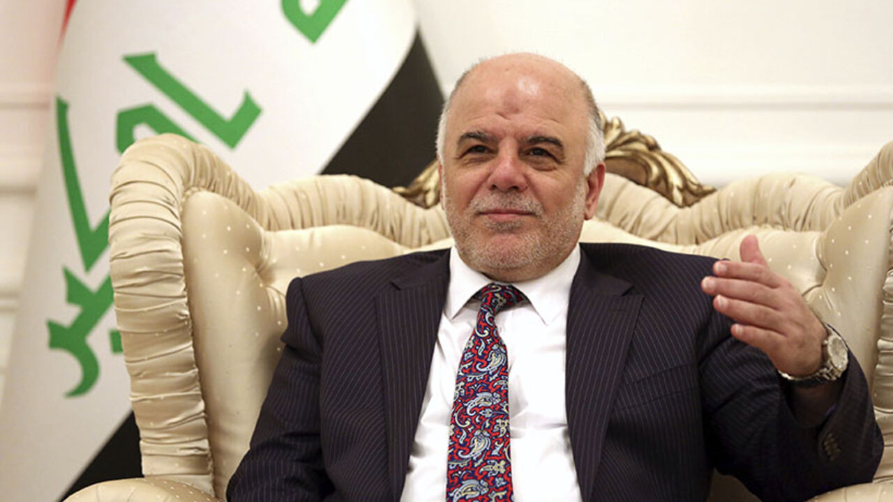 Iraq's Prime Minister-designate Haider al-Abadi smiles during a meeting German's Foreign Minister Frank-Walter Steinmeier in Baghdad August 16, 2014. Steinmeier arrived in Baghdad on Saturday for talks with Iraqi officials on what could be done to help the country in its fight against insurgents of the Islamic State. REUTERS/Hadi Mizban/Pool (IRAQ - Tags: CIVIL UNREST POLITICS CONFLICT) - RTR42MV6