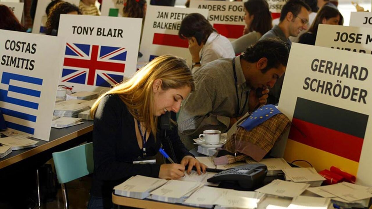 Turkish students receive phone calls and write post cards to be sent to the prime ministers of EU countries to campaign for Turkey's EU bid, in Sabanci University in Istanbul, November 27, 2002. Hundreds of thousands of postcards expressing Turkish citizens' wishes for Turkey's EU membership were couriered to the respective countries' prime ministers in a one day campaign during the festival named "One Day for European Union" at the university campus. - RTXLODF