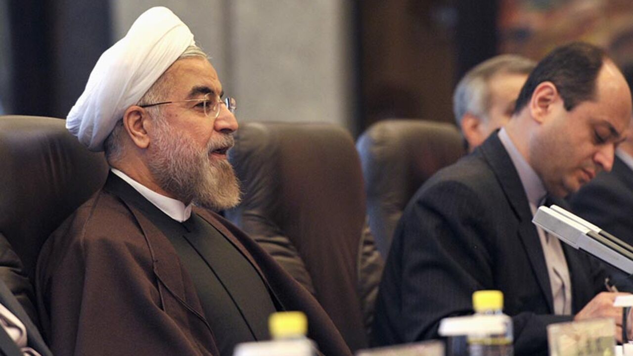 Iranian President Hassan Rouhani talks with Chinese President Xi Jinping (not pictured) during a meeting at the Xijiao State Guesthouse in Shanghai, May 22, 2014. REUTERS/Kenzaburo Fukuhara/Pool (CHINA - Tags: POLITICS) - RTR3QAM1