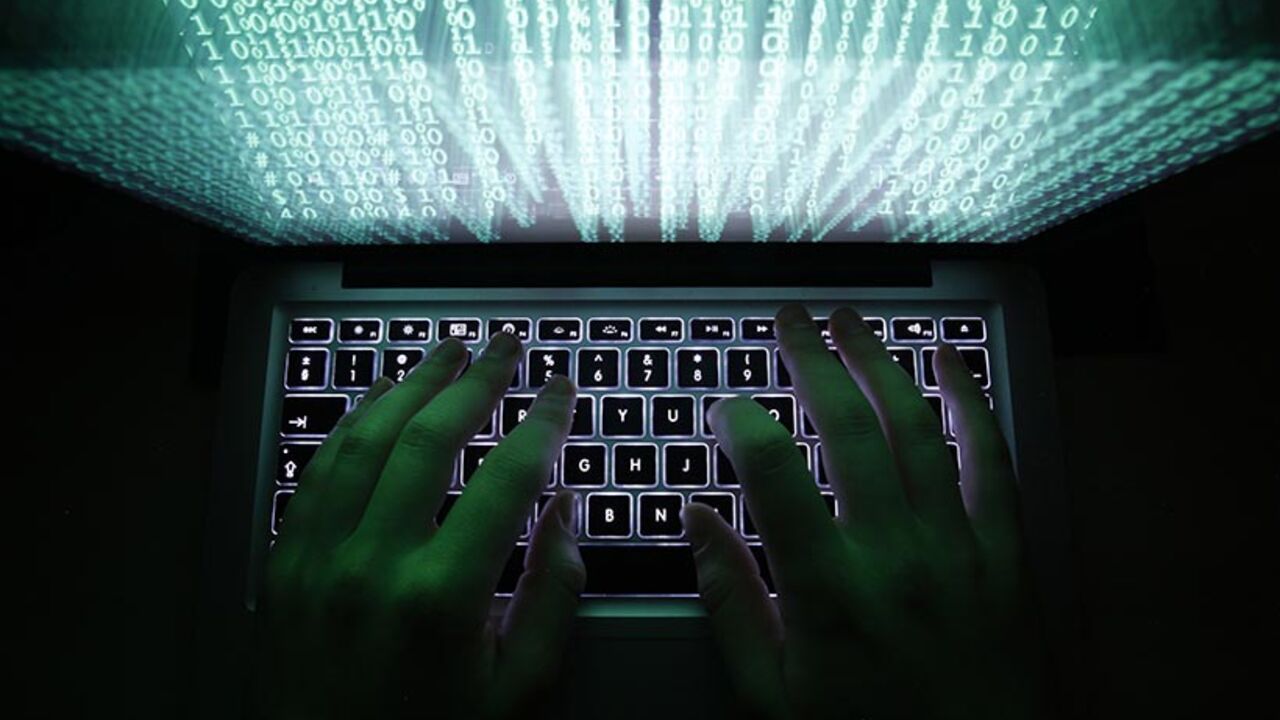 A man types on a computer keyboard in Warsaw in this February 28, 2013 illustration file picture. One of the largest ever cyber attacks is slowing global internet services after an organisation blocking "spam" content became a target, with some experts saying the disruption could get worse.        To match INTERNET-ATTACK/      REUTERS/Kacper Pempel/Files (POLAND - Tags: BUSINESS SCIENCE TECHNOLOGY) - RTXXZVX