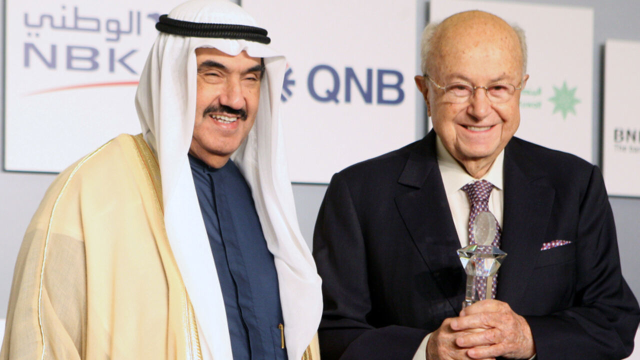 Kuwaiti Prime Minister Sheikh Nasser al-Mohammad al-Sabah (L), honours Said Khoury, chairman of the Consolidated Contractors group of Companies (CCC),  during the opening session of the 3rd Kuwait Financial Forum in Kuwait City on October 31,2011. AFP PHOTO/YASSER AL-ZAYYAT (Photo credit should read YASSER AL-ZAYYAT/AFP/Getty Images)